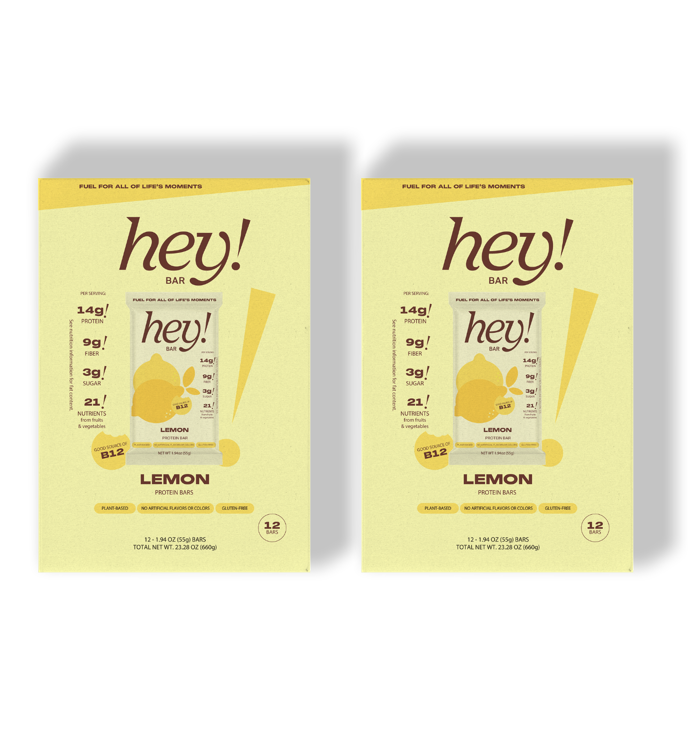 Two yellow packages of 'hey!' lemon bars side by side.