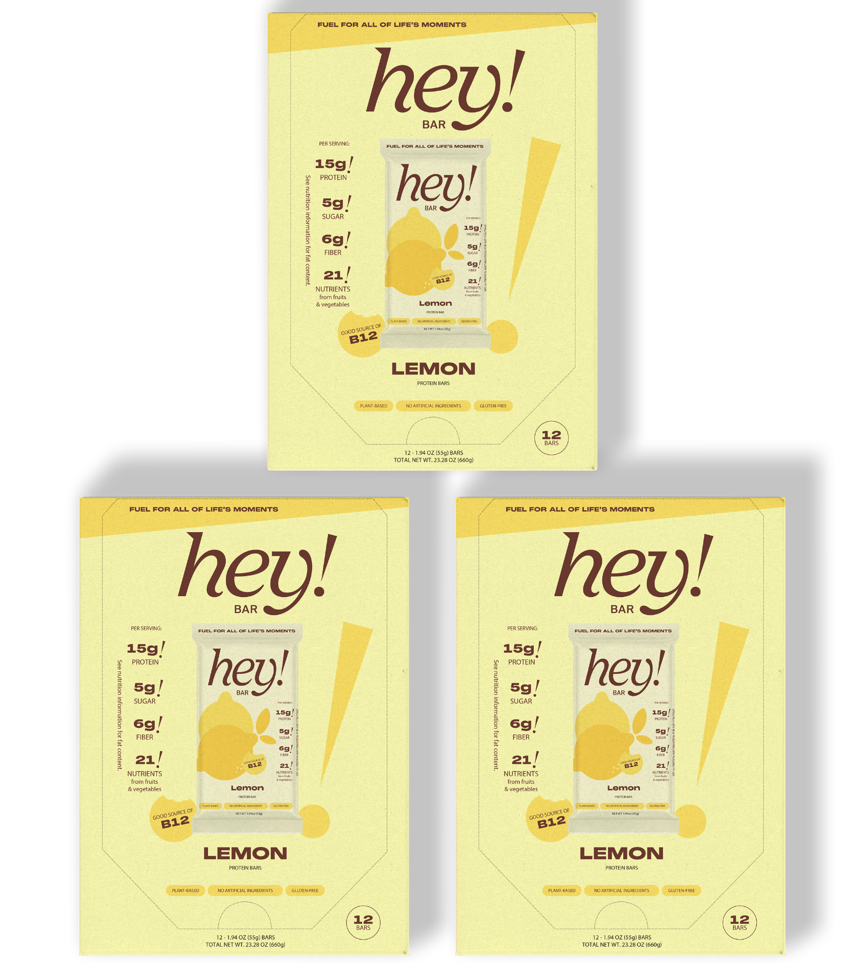 Three yellow packages of 'hey!' lemon bars: one larger box centered at the top and two smaller boxes side-by-side below.