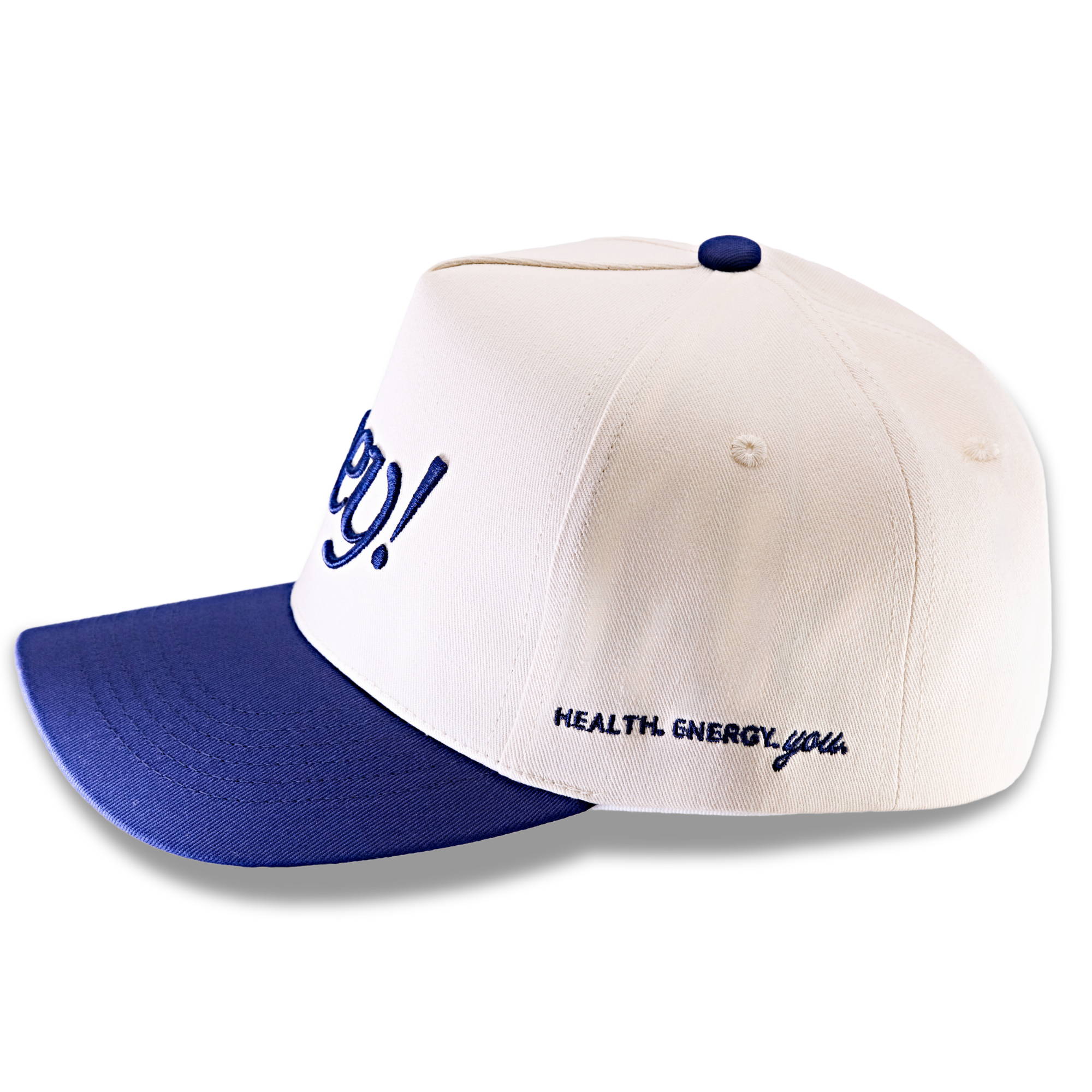 Side view of a cream-and-navy “hey!” hat embroidered with “health, energy, you.”
