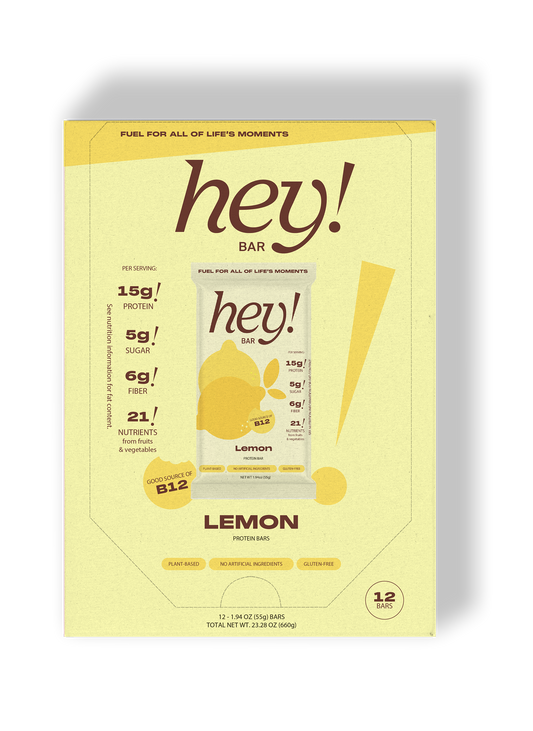 HEY! BAR Lemon 12-bar carton box in pale yellow packaging with green “hey!” branding and lemon imagery.
